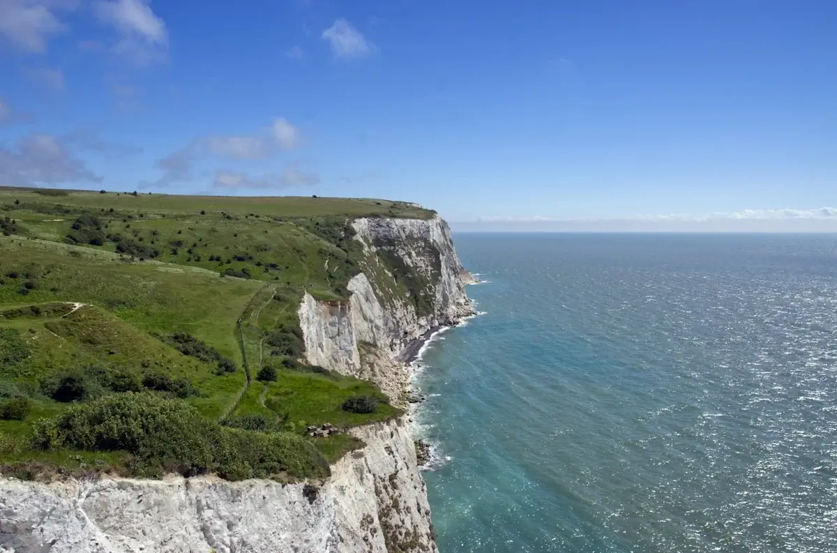 View of Durdle Door’s natural limestone arch on the Dorset coast at golden light